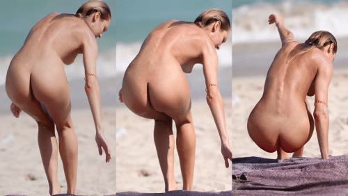 Candice Swanepoel completely nude on the beach sitting down