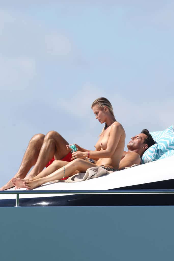 Joanna Krupa sitting on a yacht with tits out