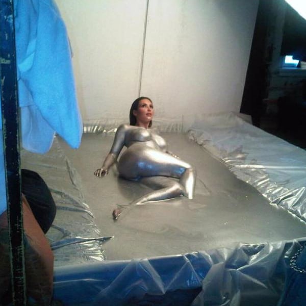 Kim Kardashian naked dipped in silver pic laying down on the ground