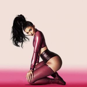 Kylie Jenner wearing maroon latex showing off curves