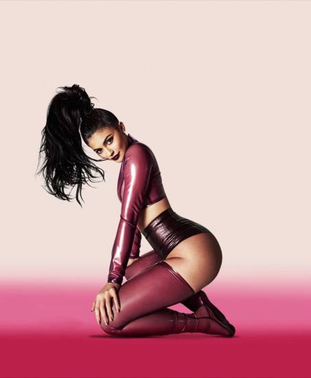 Kylie Jenner wearing maroon latex showing off curves