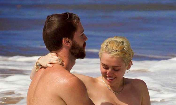 Miley Cyrus on the beach with boyfriend Patrick