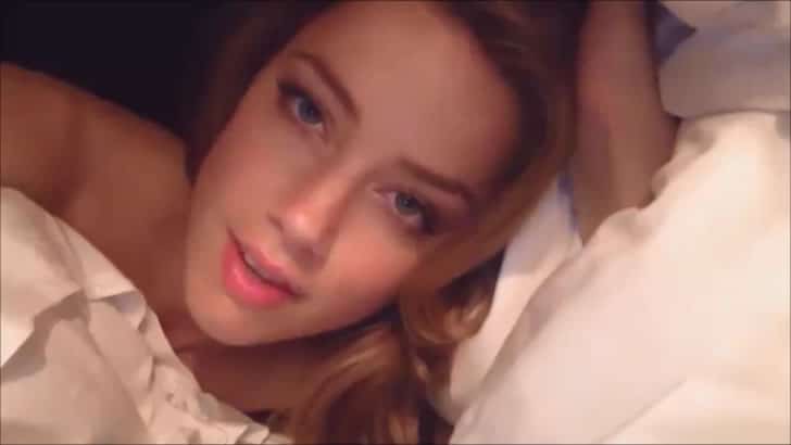 Amber Heard laying in bed