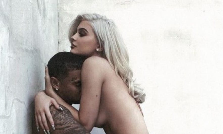 kylie jenner topless with tyga's face in her chest