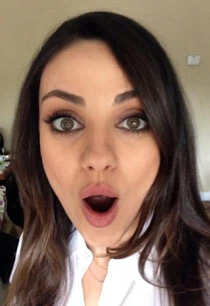 hot pic of mila kunis with her mouth open taking a selfie