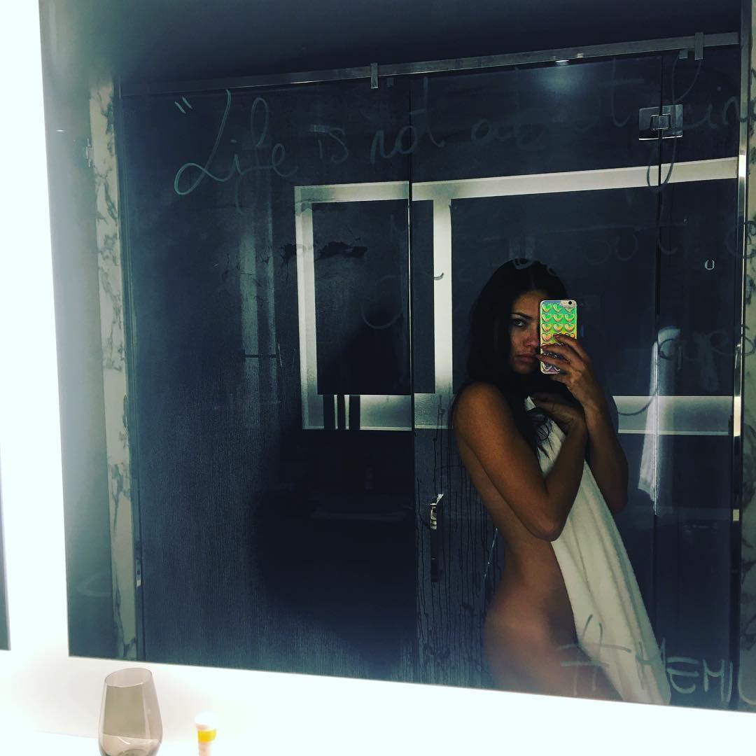 Private selfie of Adriana Lima showing her uncovered body in a mirror